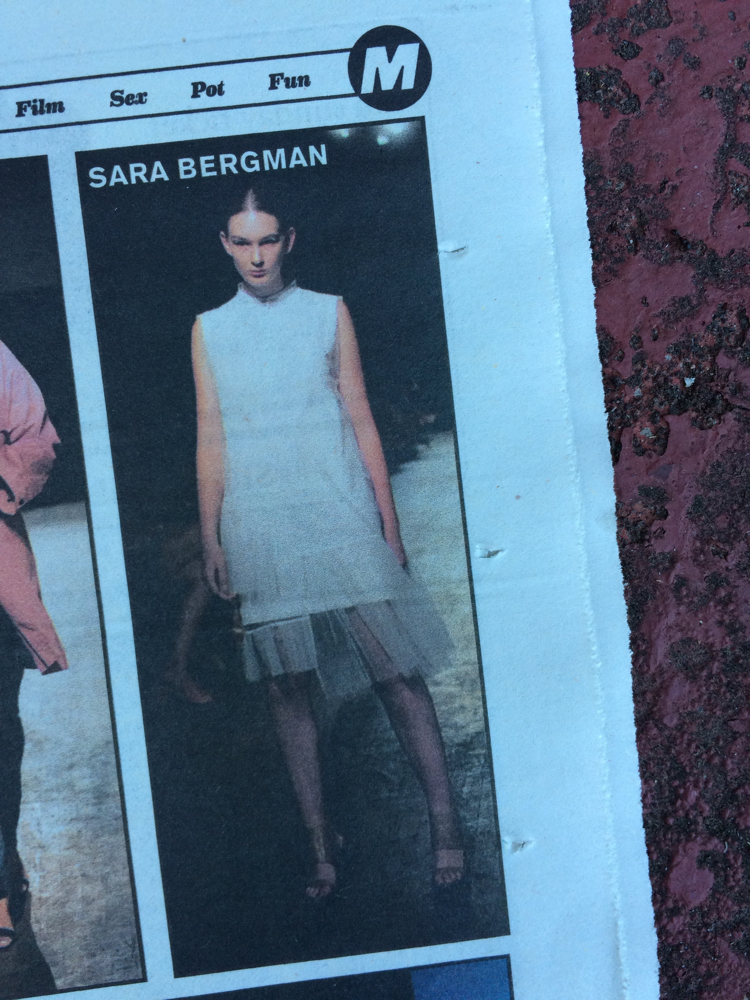 Magazine page with a model wearing a white dress, featuring the name 'Sara Bergman'.