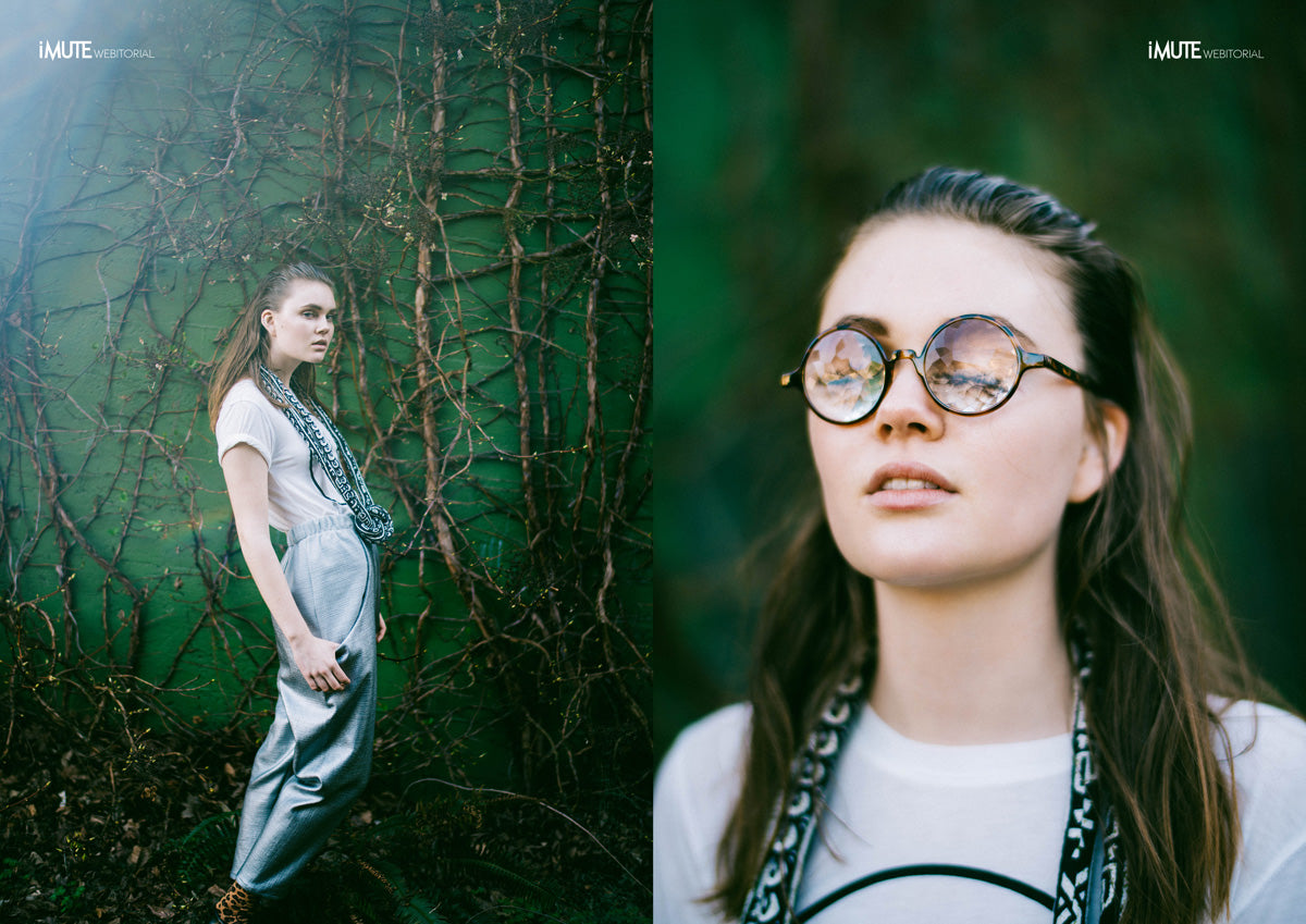 woman wearing large fabric necklace and prism glasses