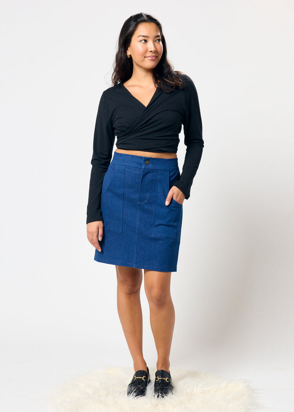 Woman wearing black top and blue denim miniskirt