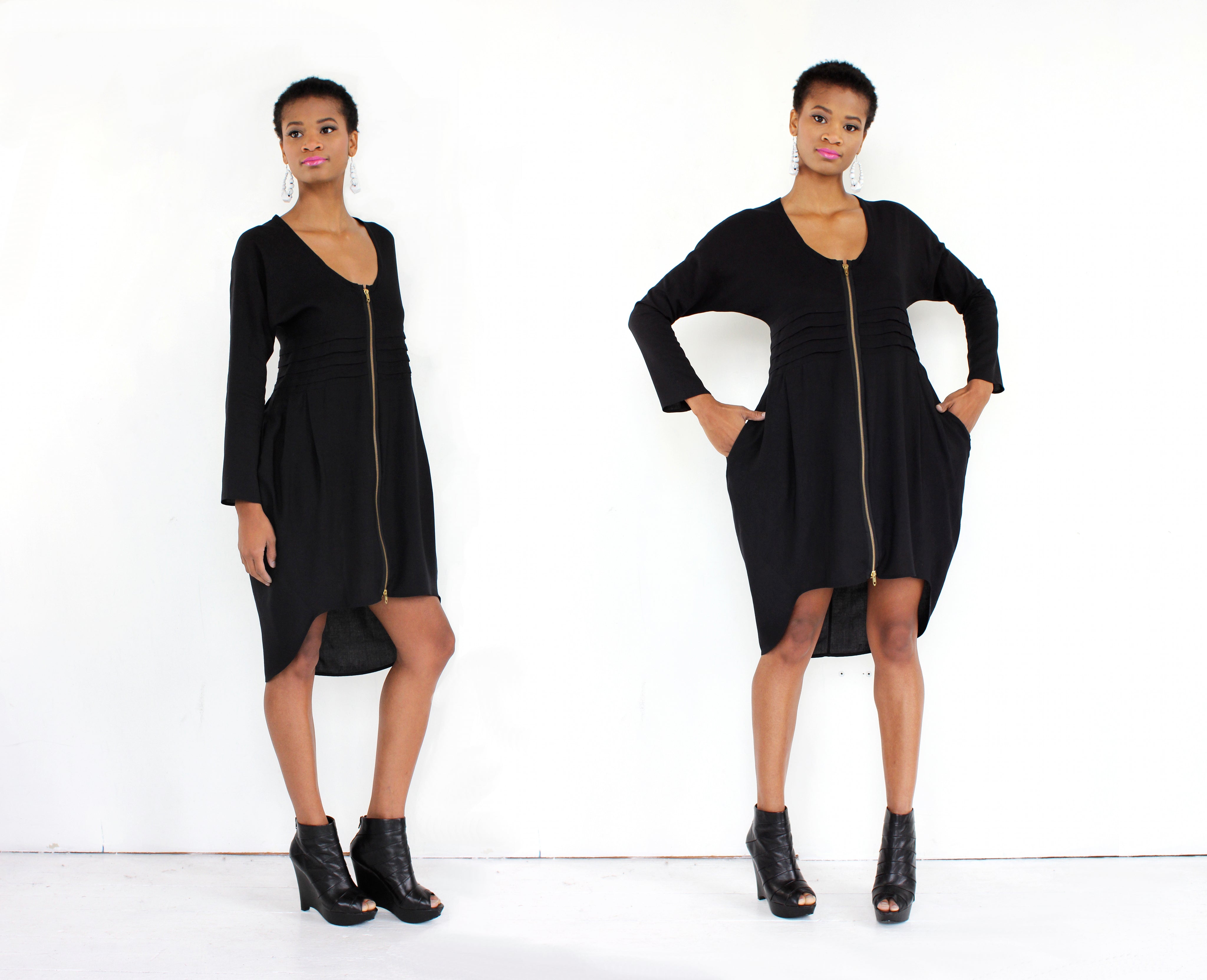 Woman wearing a black dress with a zipper on a white background