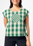 Green and white checkered top with a circle design on the chest on a plain background